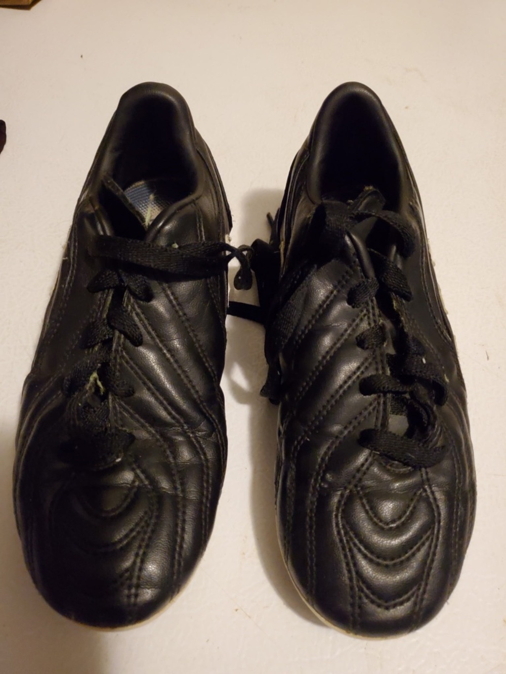 Boys baseball shoes by Adidas